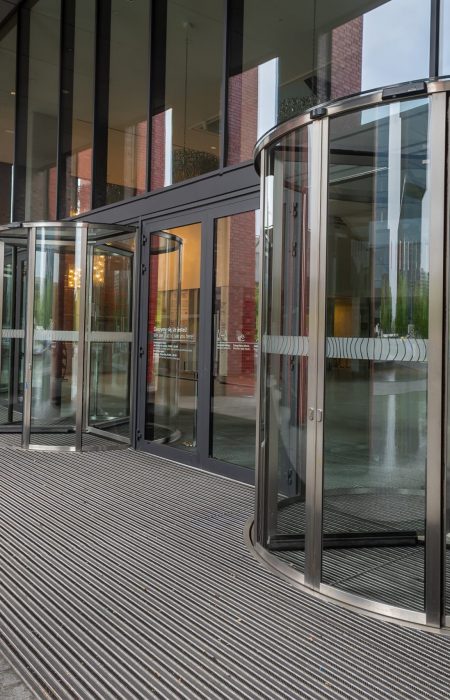 Facade of modern Business Center with glass doors.