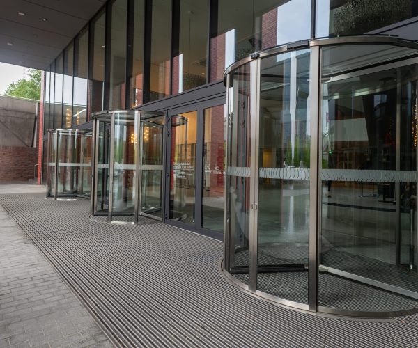 Facade of modern Business Center with glass doors.